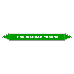 Marqueur de tuyauterie résistant indiquant 'Eau distillée chaude' en vinyle laminé.